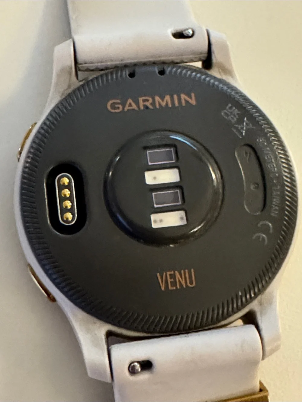 Garmin Venu Smartwatch with tan/cream Strap and rose gold Bezel